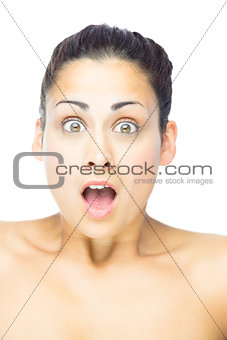 Front view of astonished woman looking at camera