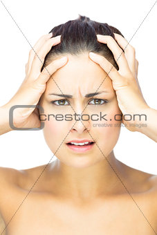Front view of irritated brunette woman looking at camera