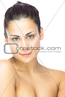 Side view of gorgeous brunette woman gazing at camera
