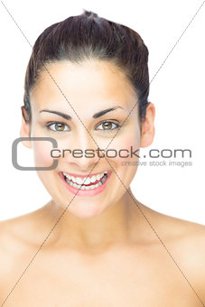 Young brunette woman laughing at camera