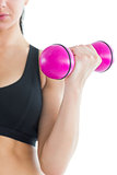 Mid section of slender active woman training her arm with a pink dumbbell