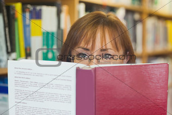 Mature female student reading a book