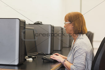 Mature female student in computer class