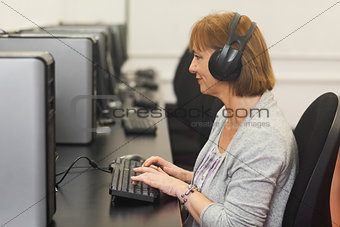 Female mature student working on computer