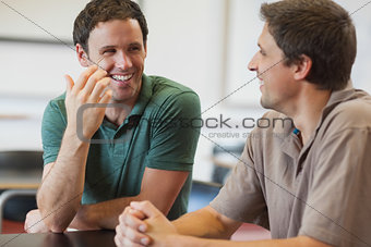 Two friendly male mature students chatting