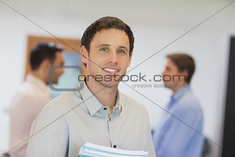 Handsome mature student posing in classroom