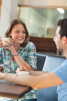 Two content students having a cup of coffee