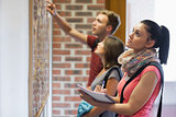Students looking at notice board
