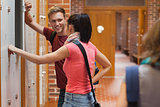 Students leaning against locker flirting