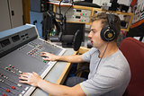 Handsome focused radio host moderating