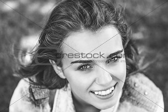 Pretty cheerful student looking at camera in black and white