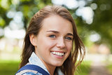 Pretty cheerful student smiling at camera
