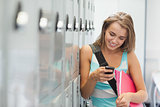 Smiling pretty student texting