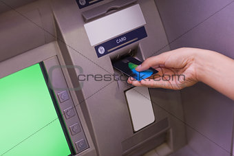 Close up of hand withdrawing cash