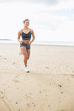 Woman jogging on a calm beach