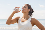 Content beautiful woman drinking of water bottle