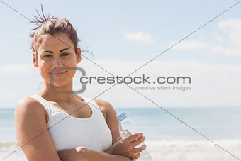 Lovely smiling woman posing on the beach