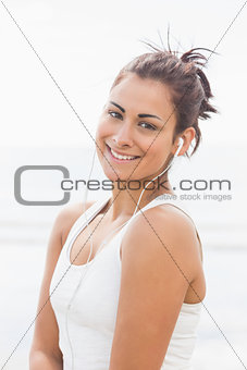 Pretty smiling woman listening to music