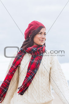 Pretty woman in stylish warm clothing looking away