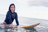 Beautiful young woman with surfboard in the water