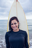 Beautiful woman with surfboard at beach