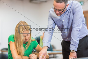 Teacher with student in the classroom