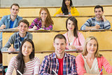 Smiling students sitting at the lecture hall