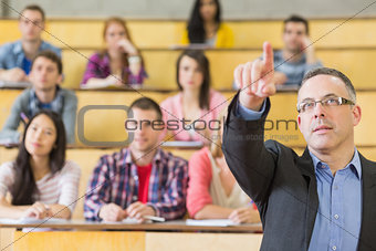 Elegant teacher and students at the college lecture hall