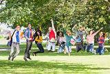 College students jumping in the park