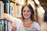 Smiling female student in the library