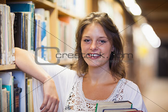 Smiling female student in the library