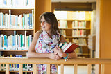 Female student with books in the library