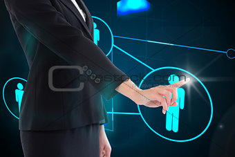 Composite image of businesswoman pointing on glowing futuristic blue background