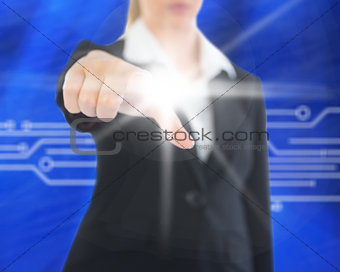 Composite image of businesswoman pointing on screen