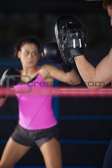 Female boxer focused on her training