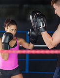 Determined female boxer focused on her training