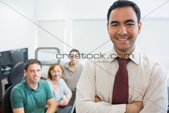 Teacher with mature students in computer room