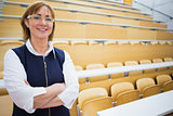 Elegant teacher standing in the lecture hall