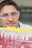 Male researcher  with at test tubes in the lab