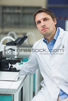 Scientific researcher with microscope in the laboratory