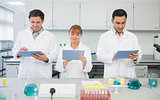 Scientists using tablet PCs in the lab