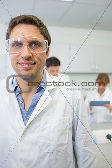 Scientist with colleagues at work in the lab