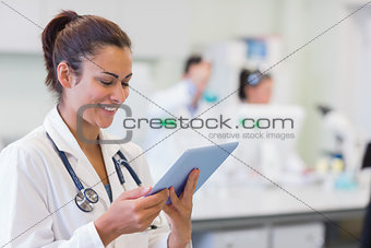 Close up of a female doctor using tablet PC