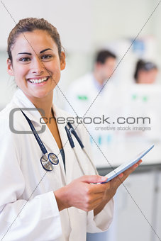 Portrait of a female doctor with tablet PC