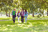 Froup of college students walking in the park