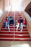 College students sitting on stairs in the college