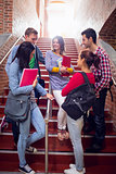College students conversing on stairs in college