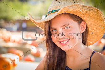 Preteen Girl Portrait Wearing Cowboy Hat at Pumpkin Patch