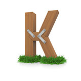 Wooden letter K in the grass