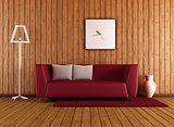 wooden living room with red couch